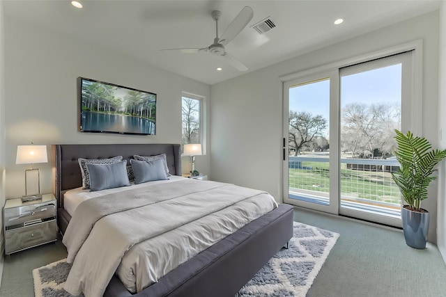 bedroom with access to exterior, ceiling fan, carpet floors, and multiple windows