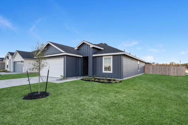 ranch-style home featuring a front yard and a garage