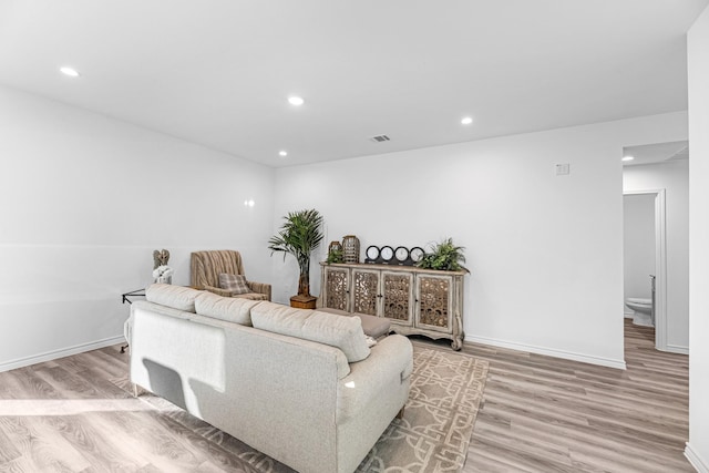 living room with light hardwood / wood-style flooring