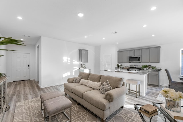 living room with light hardwood / wood-style flooring