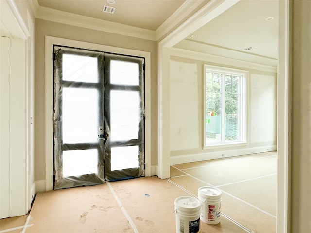 doorway to outside with ornamental molding