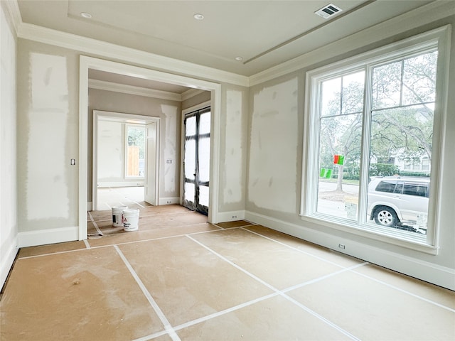 tiled empty room with crown molding and plenty of natural light