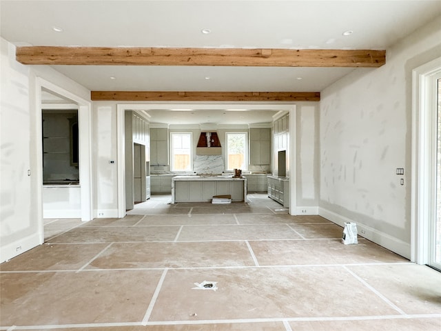 interior space featuring beam ceiling