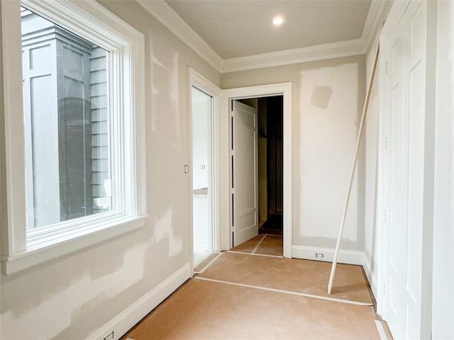 unfurnished bedroom with a closet and ornamental molding