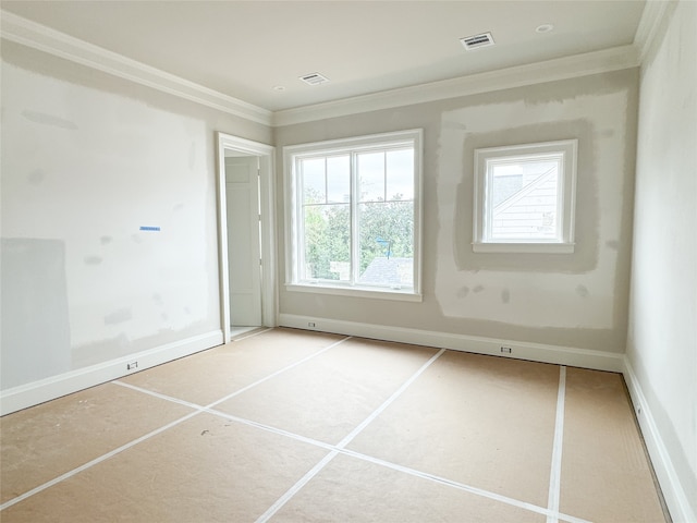 unfurnished room featuring ornamental molding