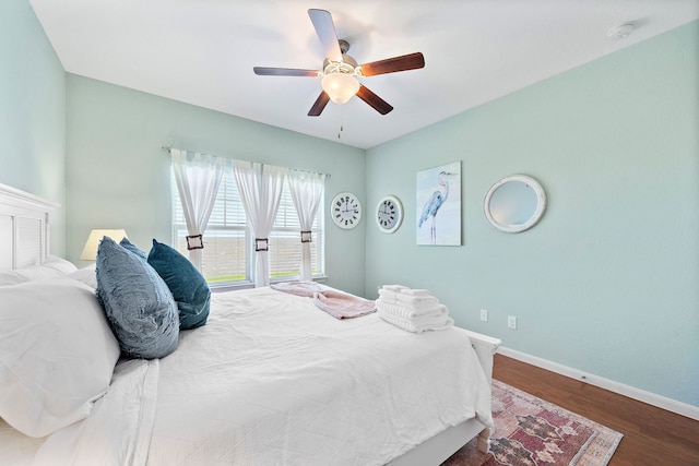 bedroom featuring ceiling fan and hardwood / wood-style flooring