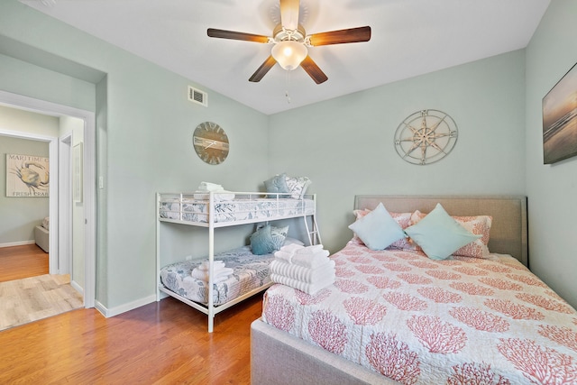 bedroom featuring ceiling fan and light hardwood / wood-style flooring