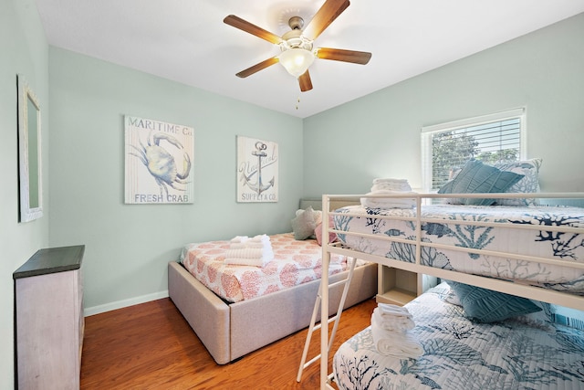 bedroom with light hardwood / wood-style floors and ceiling fan