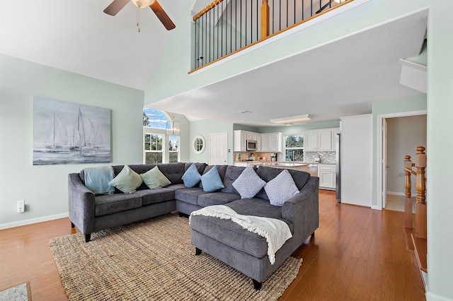 living room featuring light hardwood / wood-style floors and ceiling fan