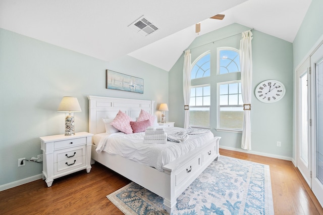 bedroom with vaulted ceiling and wood-type flooring