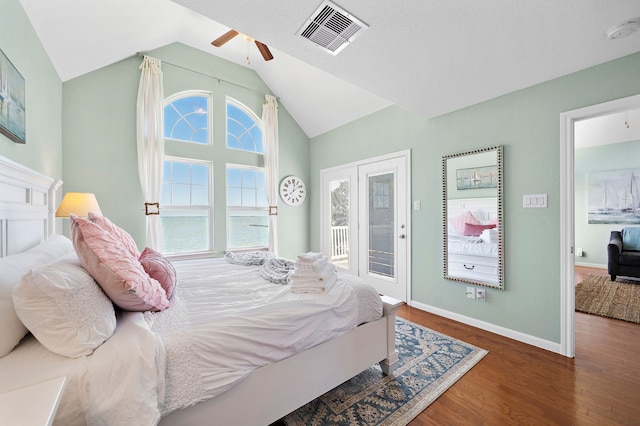 bedroom featuring lofted ceiling, access to exterior, ceiling fan, and dark hardwood / wood-style floors