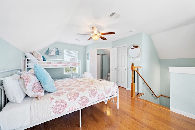 bedroom with lofted ceiling, light hardwood / wood-style floors, and ceiling fan