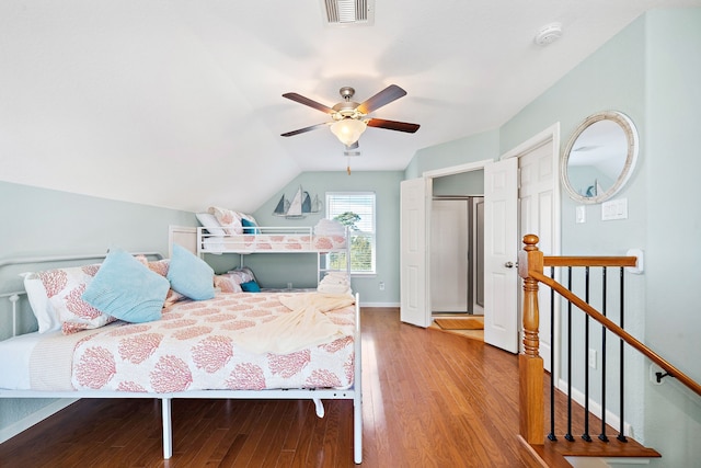 bedroom featuring ceiling fan, light wood-type flooring, and vaulted ceiling