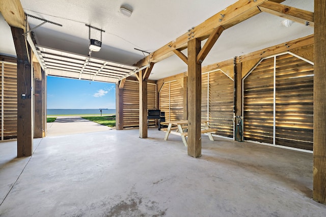 garage featuring a water view and a garage door opener