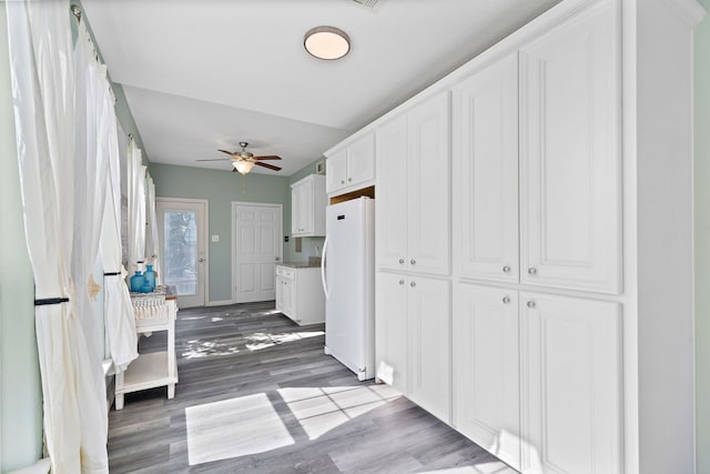 interior space featuring ceiling fan and hardwood / wood-style floors