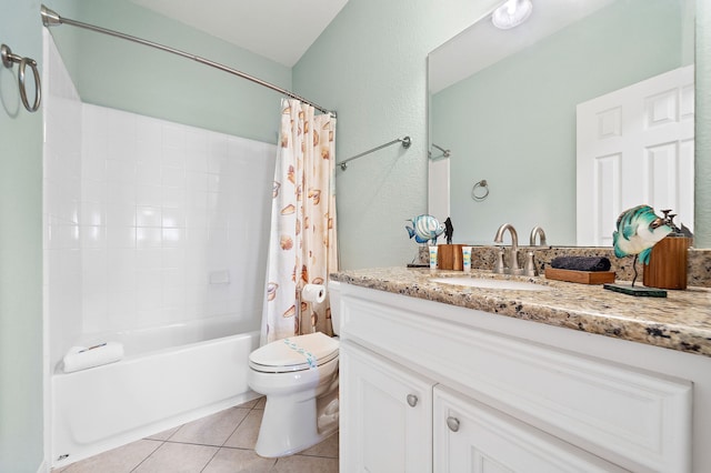 full bathroom with tile floors, toilet, shower / bath combo, and vanity with extensive cabinet space