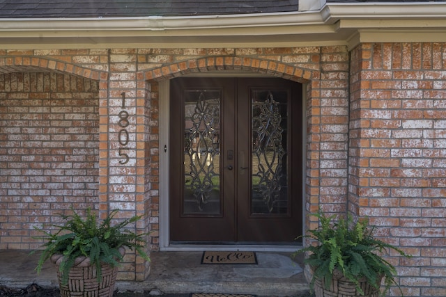 entrance to property featuring french doors