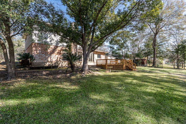 view of yard with a wooden deck