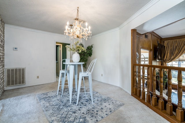 carpeted dining room with brick wall, crown molding, a textured ceiling, and an inviting chandelier