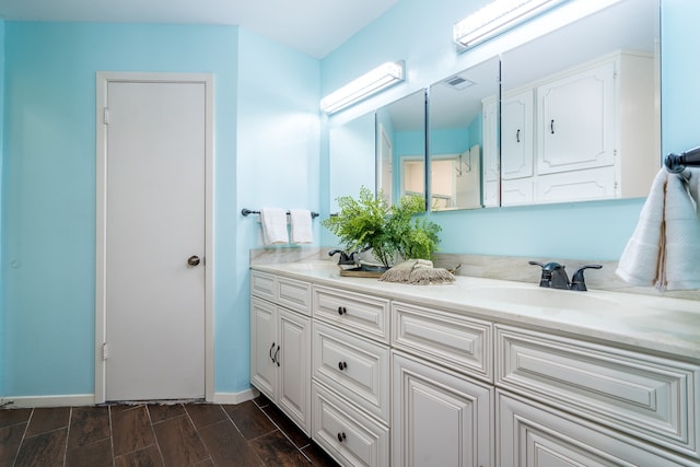 bathroom with double sink and oversized vanity