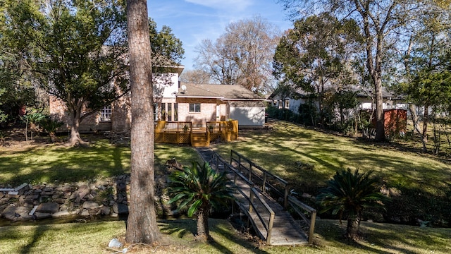 view of yard with a wooden deck