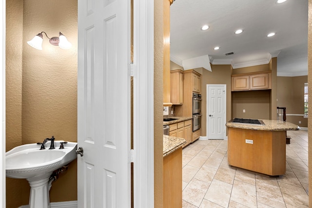 interior space featuring light brown cabinetry, light tile floors, a breakfast bar area, and light stone counters