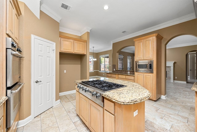 kitchen with crown molding, light stone countertops, stainless steel appliances, and light tile floors