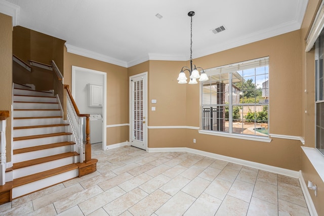 interior space with an inviting chandelier, washer / dryer, and ornamental molding