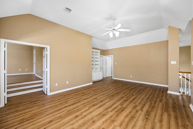 unfurnished room featuring vaulted ceiling, ceiling fan, and wood-type flooring