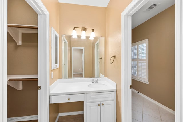 bathroom featuring oversized vanity and tile flooring