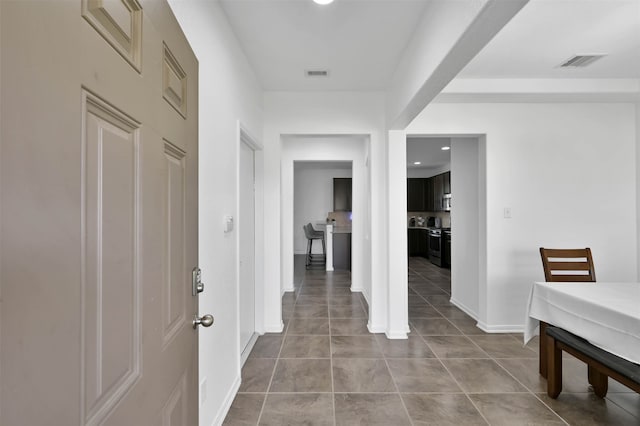 interior space featuring light tile floors