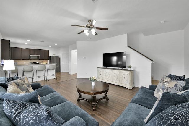 living room with ceiling fan and wood-type flooring