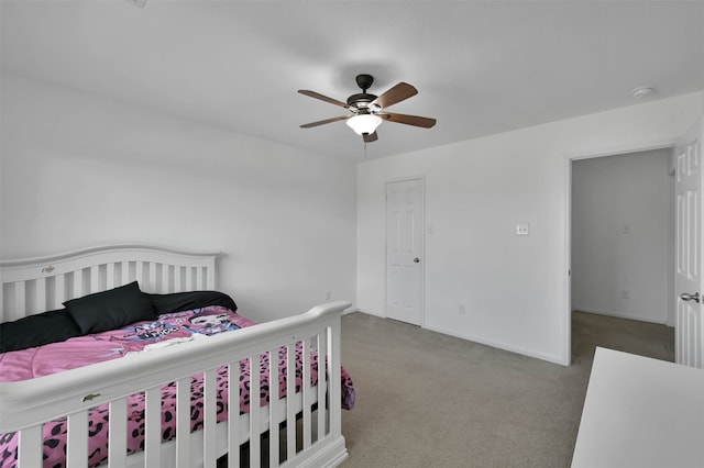 bedroom with dark carpet and ceiling fan