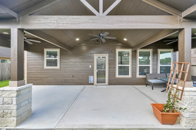 doorway to property featuring ceiling fan and a patio