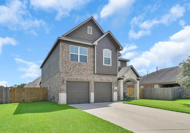 view of front property with a front lawn and a garage