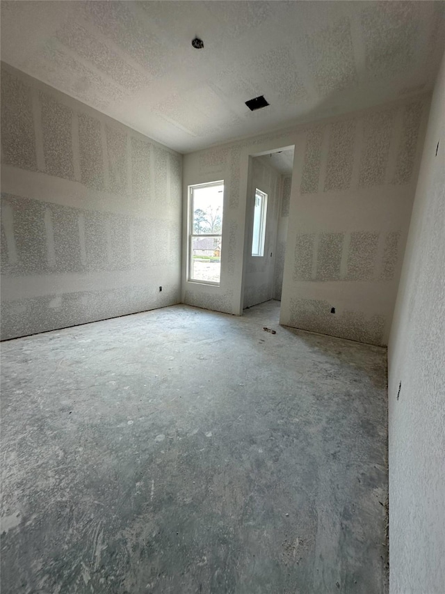 spare room featuring a textured ceiling