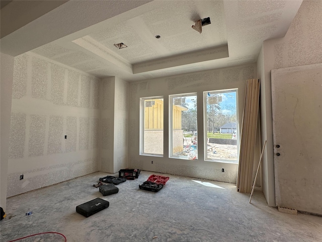 spare room with a raised ceiling and a textured ceiling