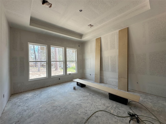 unfurnished room featuring visible vents and a raised ceiling