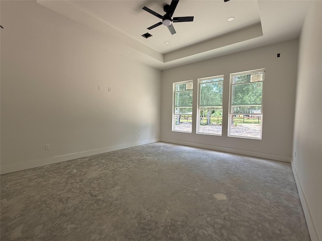 2723 Michaelangelo St, New Caney, TX 77357 - empty room with a ceiling fan, a raised ceiling, and recessed lighting