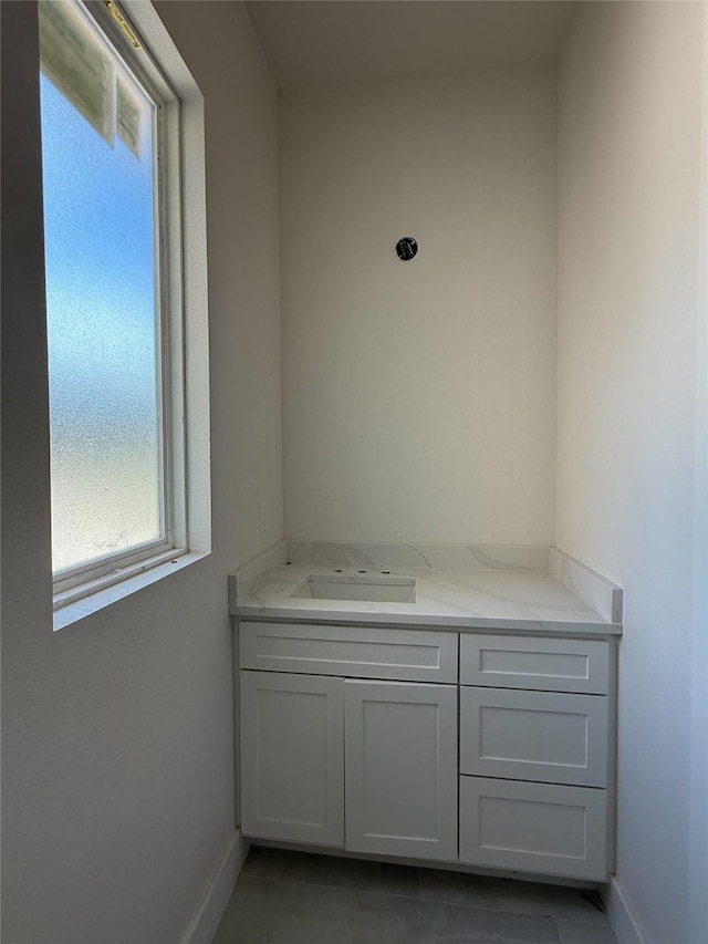 2723 Michaelangelo St, New Caney, TX 77357 - bathroom featuring plenty of natural light, vanity, and tile patterned flooring