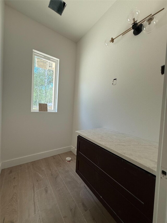 2723 Michaelangelo St, New Caney, TX 77357 - mudroom featuring wood finished floors and baseboards