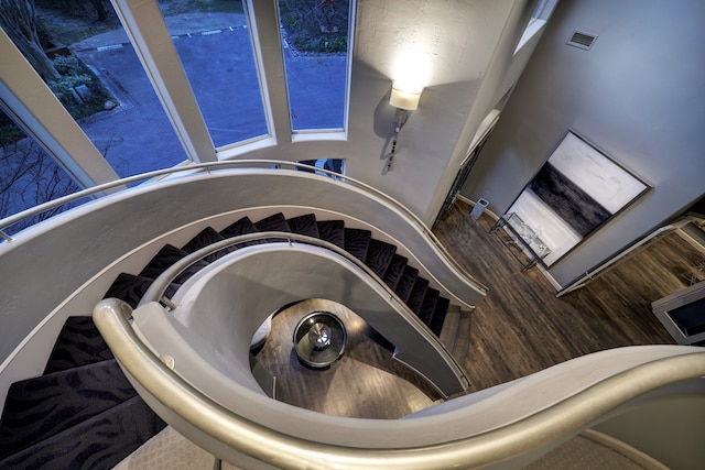 stairs featuring a high ceiling