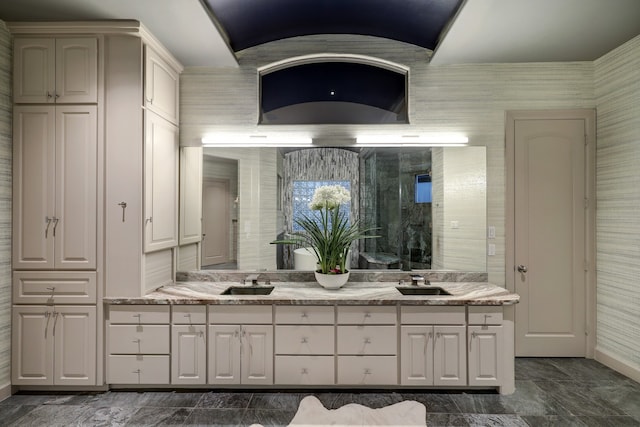 bathroom with oversized vanity, tile floors, and dual sinks