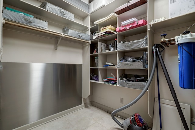 spacious closet featuring light tile floors