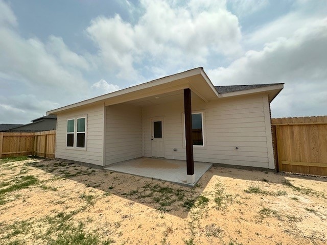 back of house with a patio