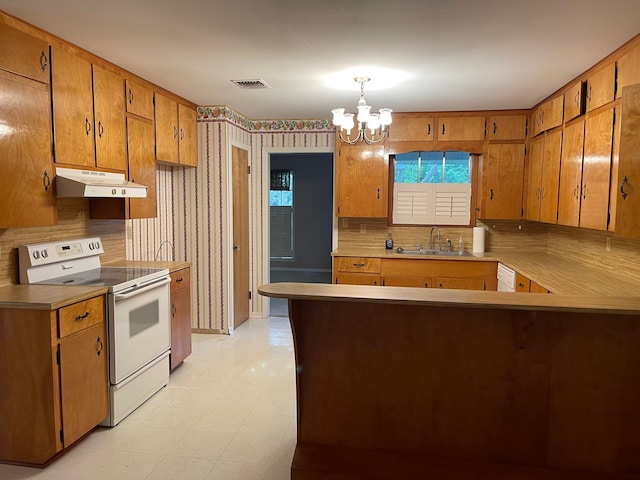 kitchen with kitchen peninsula, white appliances, a notable chandelier, backsplash, and light tile floors