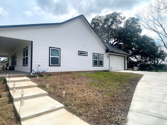 view of property exterior featuring a garage