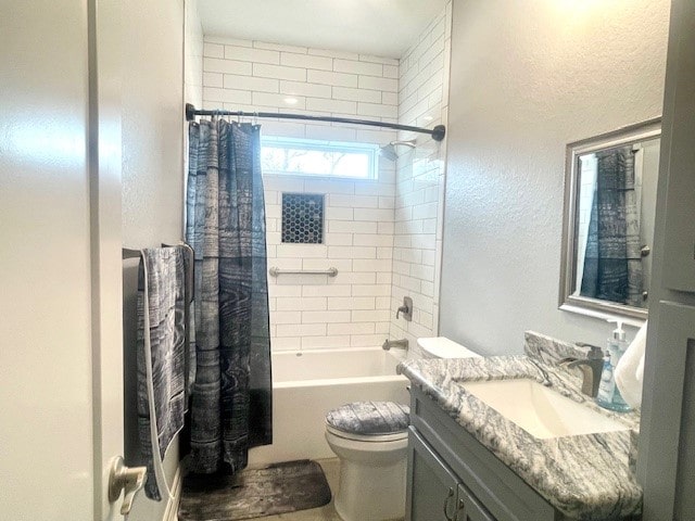 full bathroom with shower / tub combo, toilet, and vanity