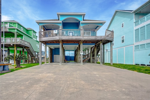 exterior space featuring a balcony and a garage