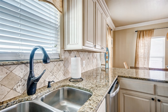 kitchen featuring sink, ornamental molding, stainless steel dishwasher, light stone countertops, and tasteful backsplash